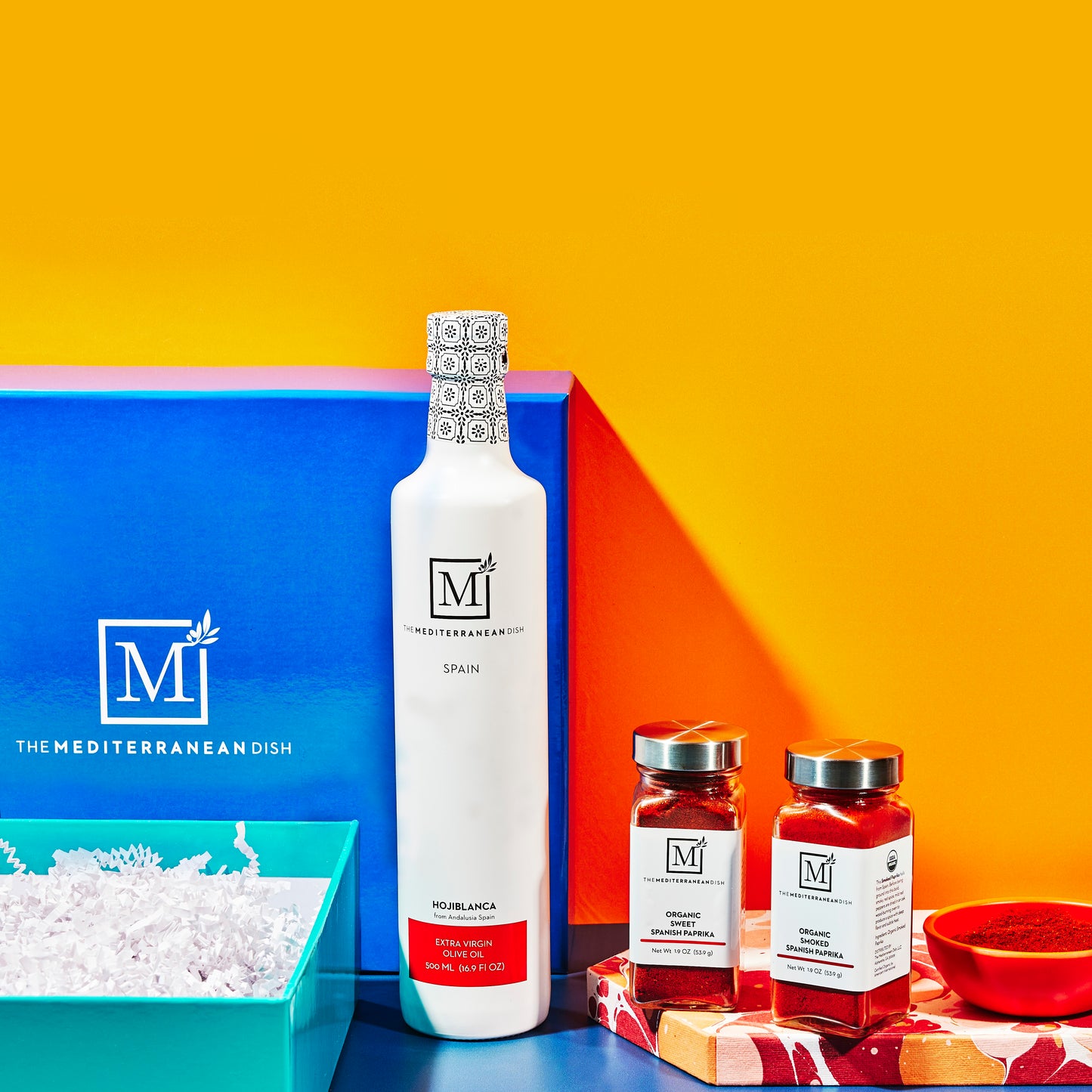 Product display with bottles and jars on a colorful background