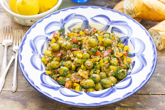 A close up of olive salad in a serving bowl.