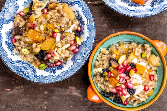 An overhead photo of two serving dishes filled with wheat berry pudding.