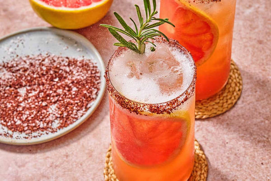 Rosemary grapefruit mocktail with a sumac salt rim.