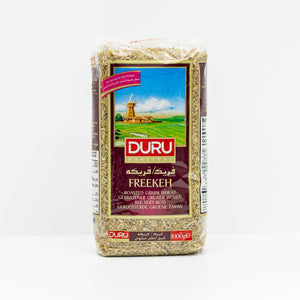 A package of DURU Freekeh roasted green wheat flour, shown against a plain white background. The packaging features a prominent brown label with a picture of a windmill in a green field and the brand name 'DURU' in red.