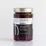 A jar of Greek Kalamata pitted olives with a silver cap on a clean white background. 