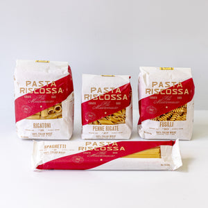 Four packages of Pasta Riscossa on a white background.